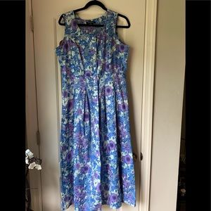Woman’s fully lined, maxi length floral cotton dress. Sleeveless.
